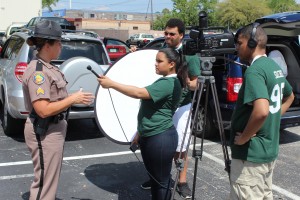 Stephanie Romero asks Sgt. Kim Montes of the Florida Highway Patrol about pedestrian safety on International Drive.