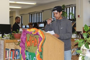 Freshman Miguel Alvarez grabs the mic during an emotional moment in his poem Wednesday.