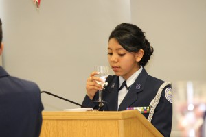 C/Maj Suhailey Saavedra raises a toast.  She served as the "President of the Mess," a role equivalent to the Master of Ceremonies.