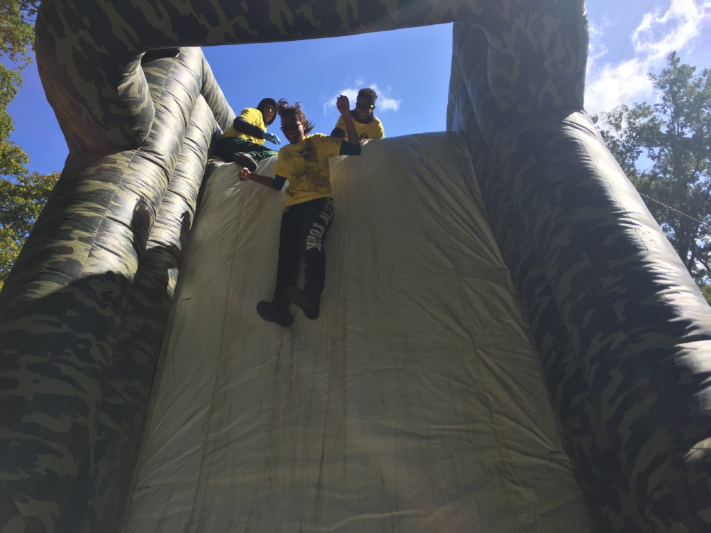 Truman junior Claudya McLeod free-falls through the air while enjoying one of the obstacles at Sunday's Down and Dirty Obstacle Race.