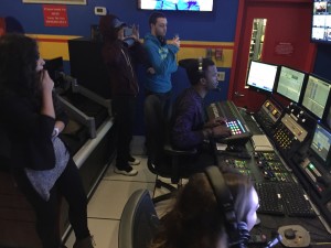 Students watch carefully as director Moziah Sterling and producer Alexa DePalma run the 11:30a.m. broadcast at News 12 the Bronx.