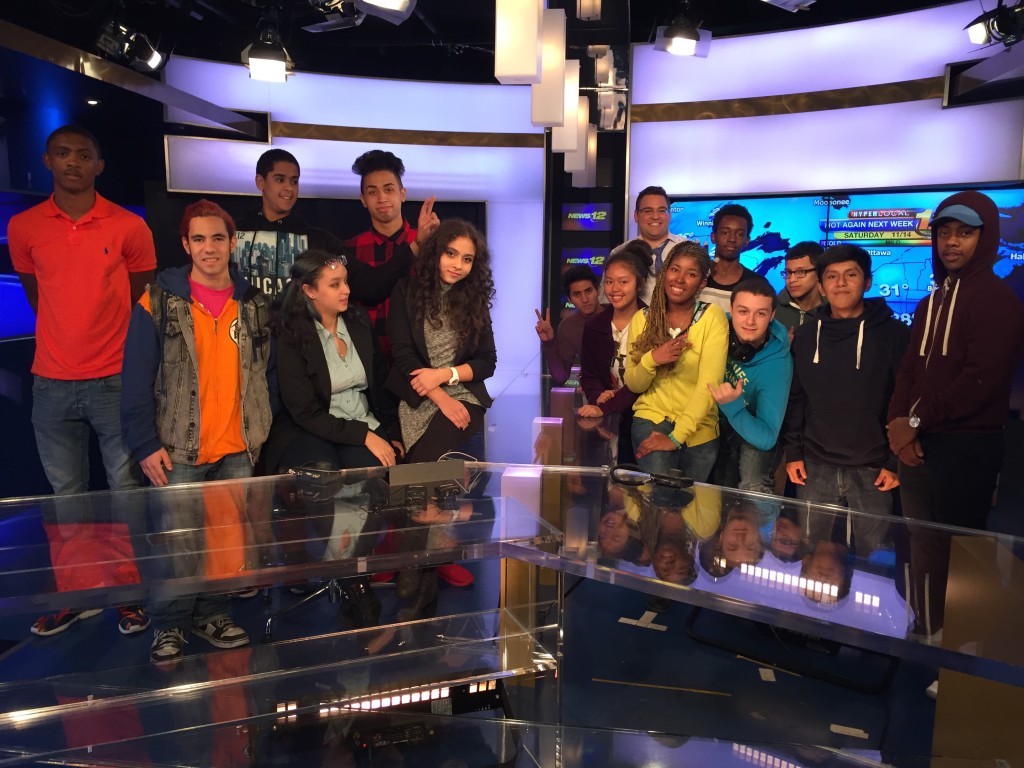 Students from the Truman Media Program pose for a photo in the News 12 studios.