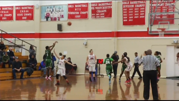 Arianna Davis puts up  a 3-point basket against Cardinal Spellman.  The Lady Mustangs beat Spellman, 54-49.