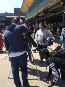 Students line up to take a look through a microscope as Mercury crosses in front of the sun.