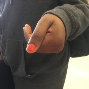 A student wanted to rep with an orange nail