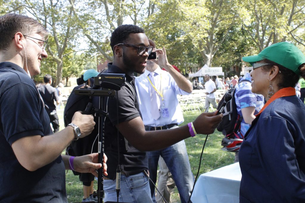 Lester Robinson interviews a visitor at the Vendy Awards on Governor's Island in September.